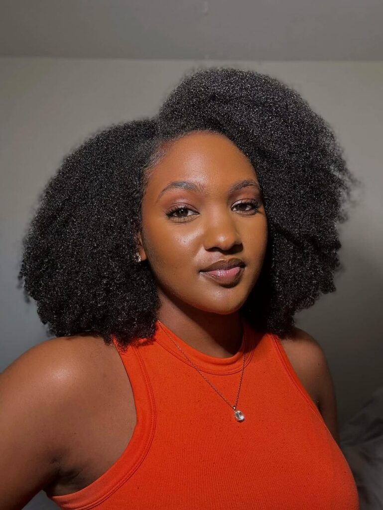 a lady with a full Afro Hair