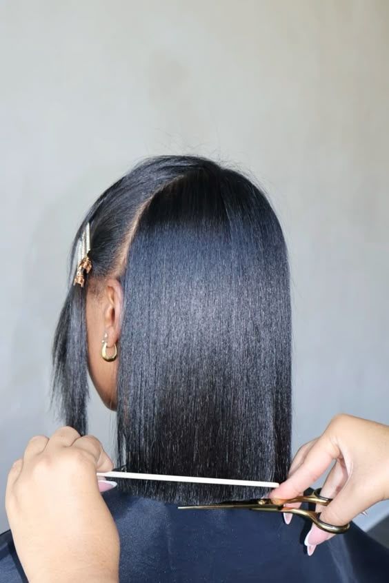 a lady trimming her stretched hair