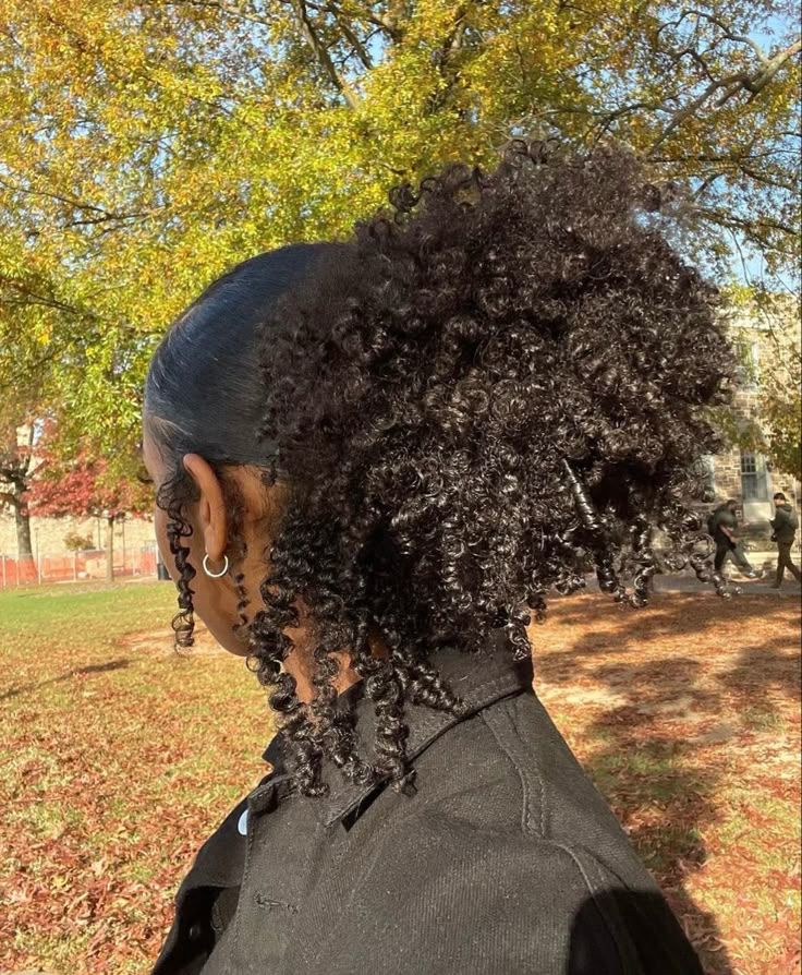 a girl with type 4B hair