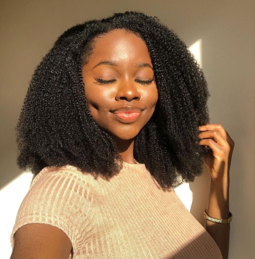 a girl with 4C hair