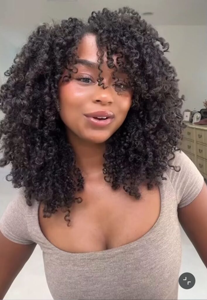 a girl with full curl pattern