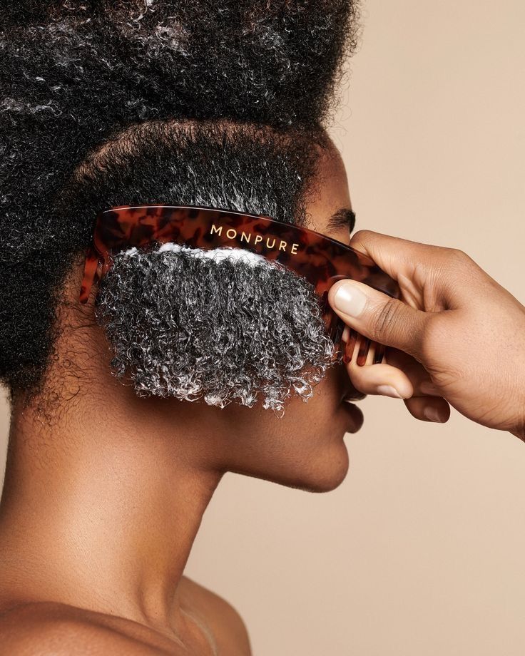 a lady applying deep conditioner on her Perfect Afro Hair Care Routine Journey