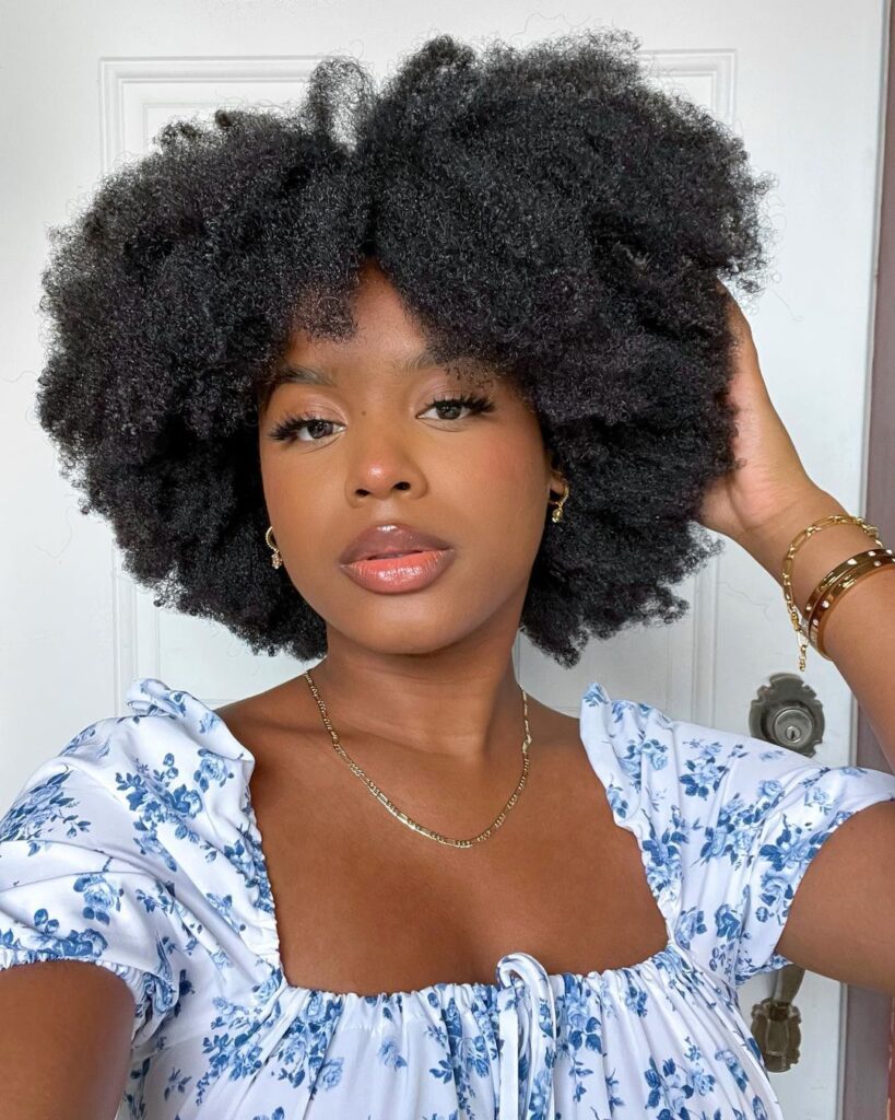 a lady with afro hair
