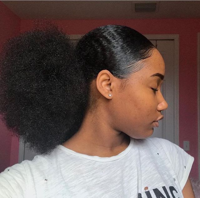 a girl on afro low puff as a simple beginners afro hairstyle