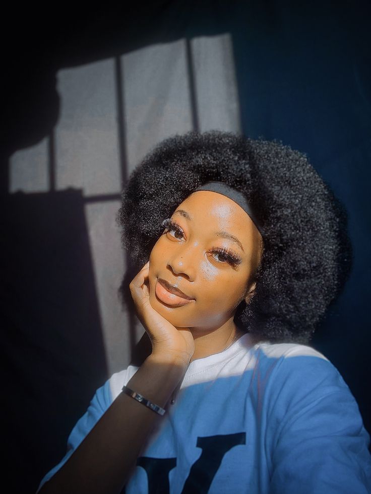 a girl with afro with headband