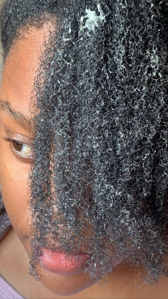 someone applying hair conditioner