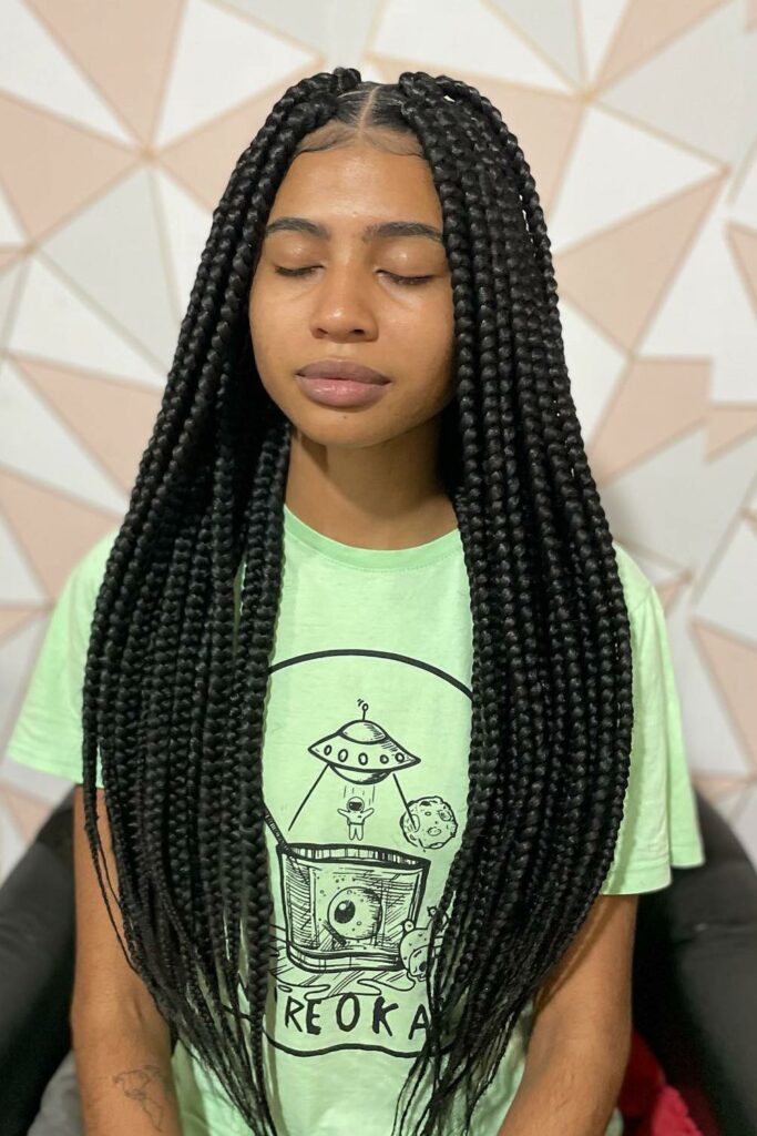 a girl with braids and edges laid