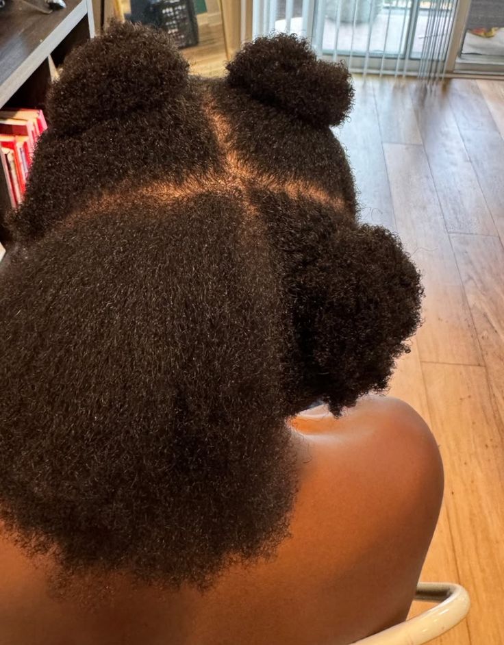 someone that divided her hair into 4 places to check how healthy her scalp is