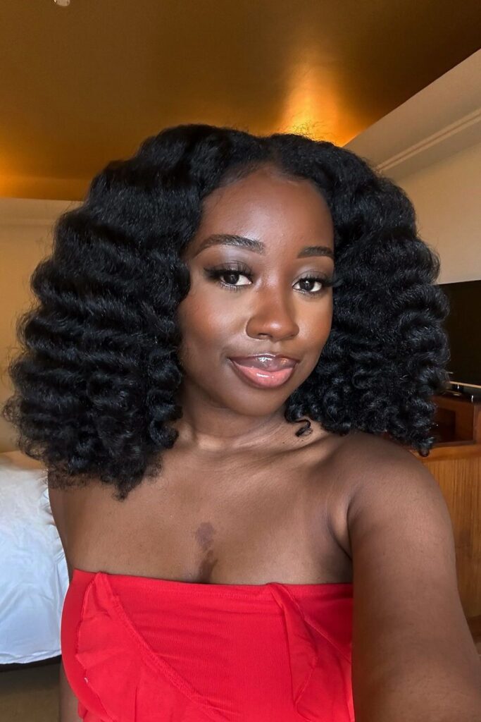 a lady with chunky twist out beautiful hairstyle