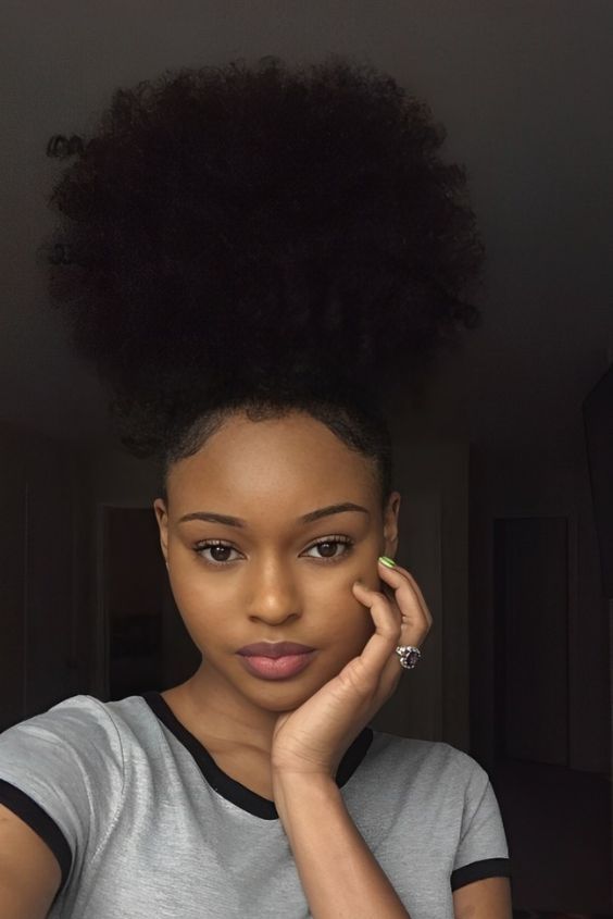 a girl with classic high afro simple natural hairstyle