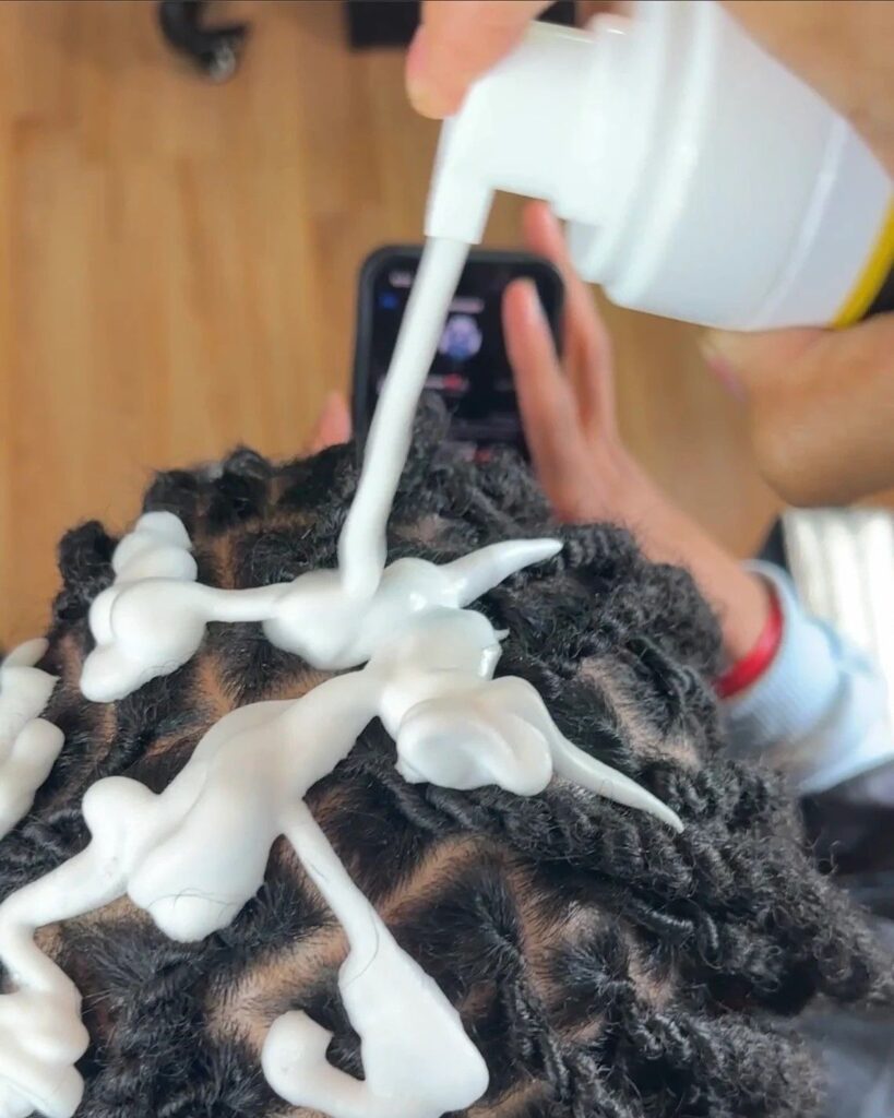 picture of someone cleaning their scalp