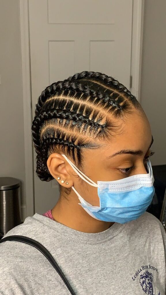 a fair girl with cornrows protective style for afro hair