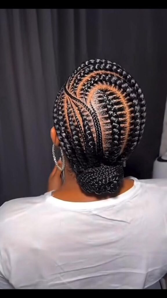 picture of someone with cornrows with a bun beautiful hairstyle
