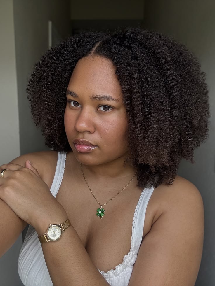 a girl with curly 4C hair