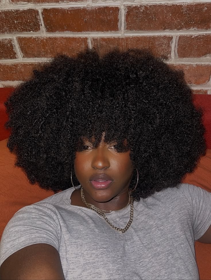 a lady with curly afro hair