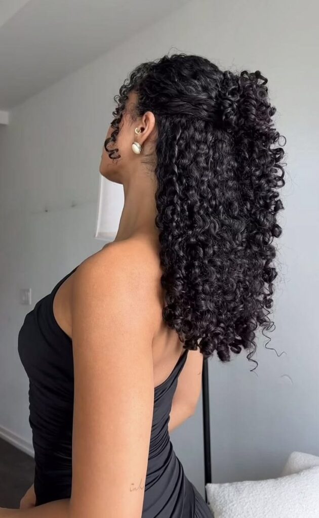 a tall girl with curly hair