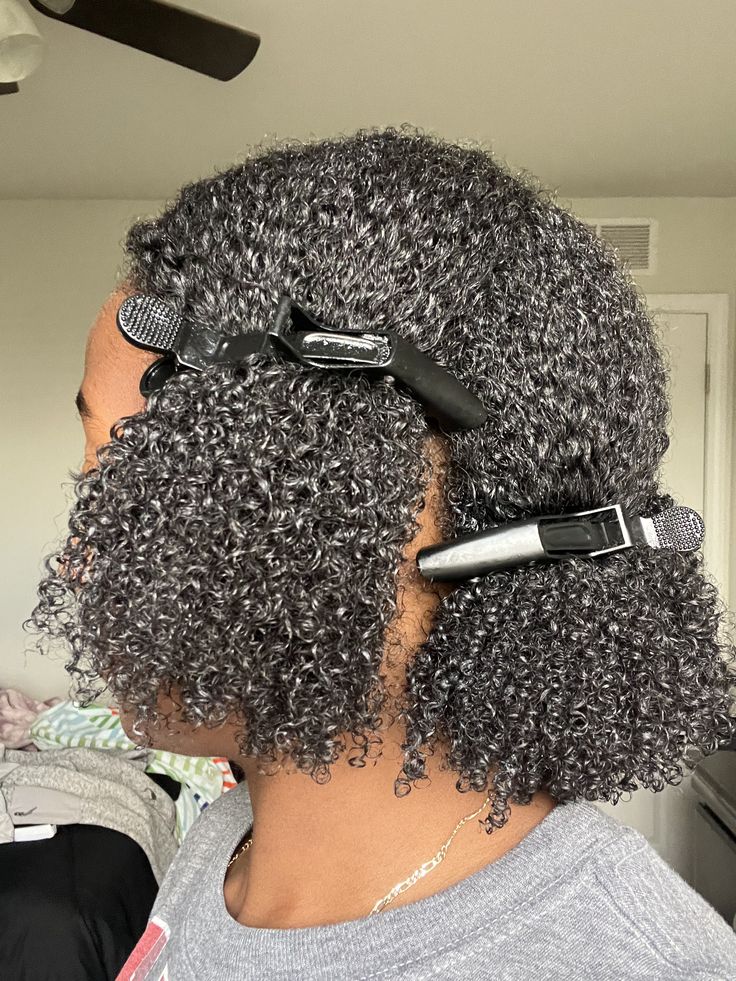 a curly hair with clips
