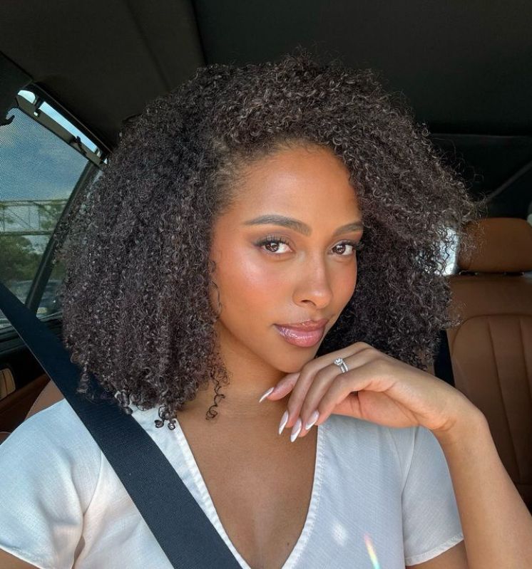 a girl with curly type 4 hair