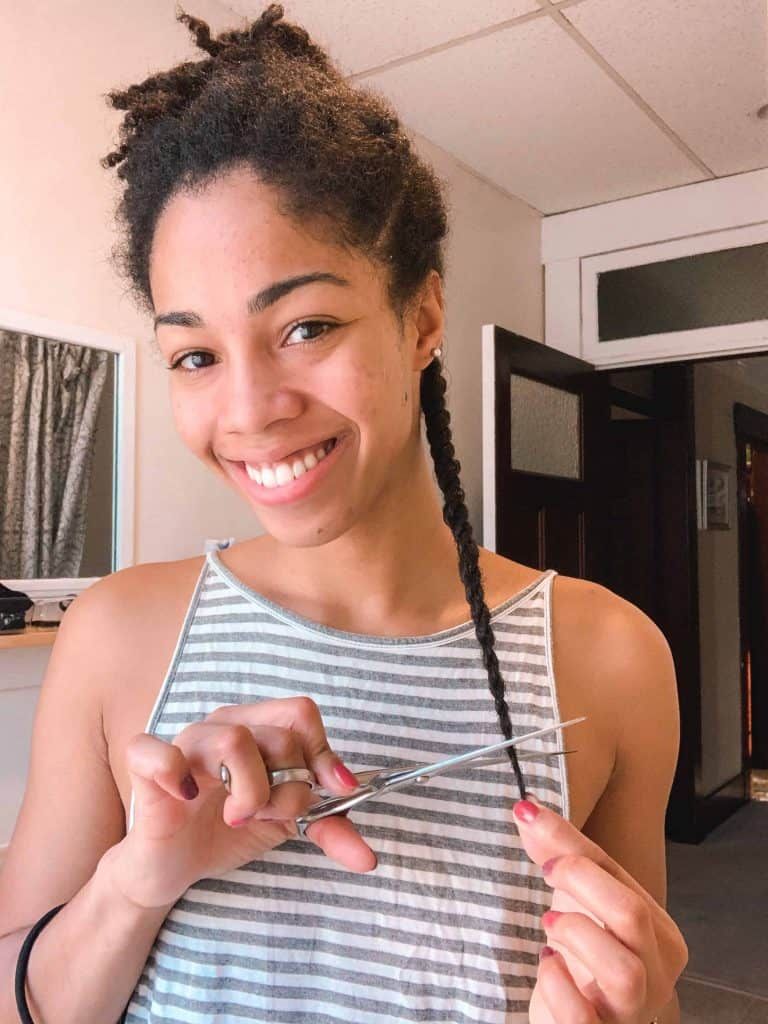 a girl about to cut her braids
