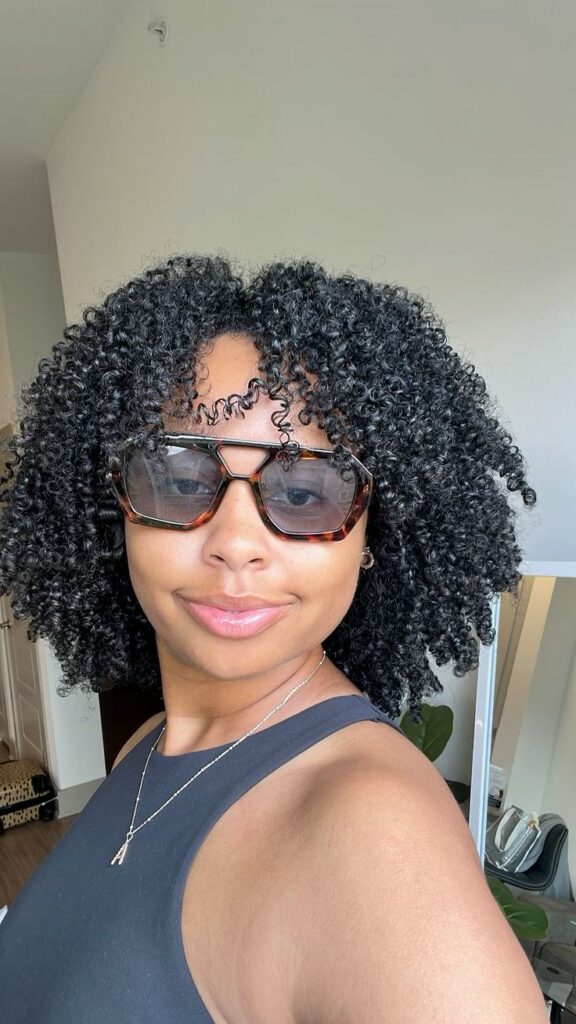 a lady with defined wash and go