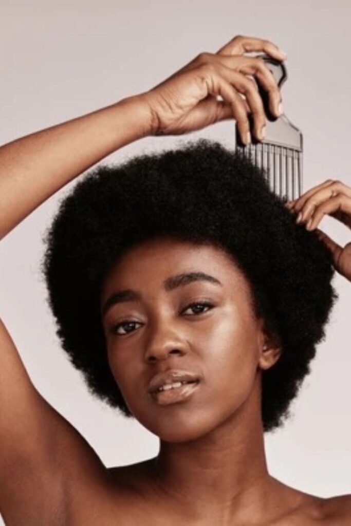 someone detangling her hair