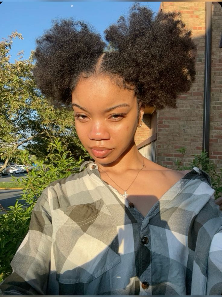 a fair girl with double afro puffs style