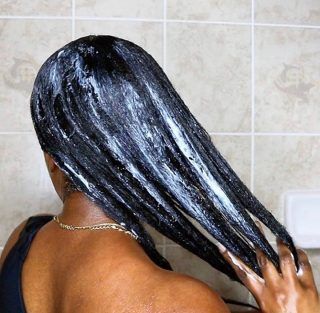someone that applied hair butter to her hair