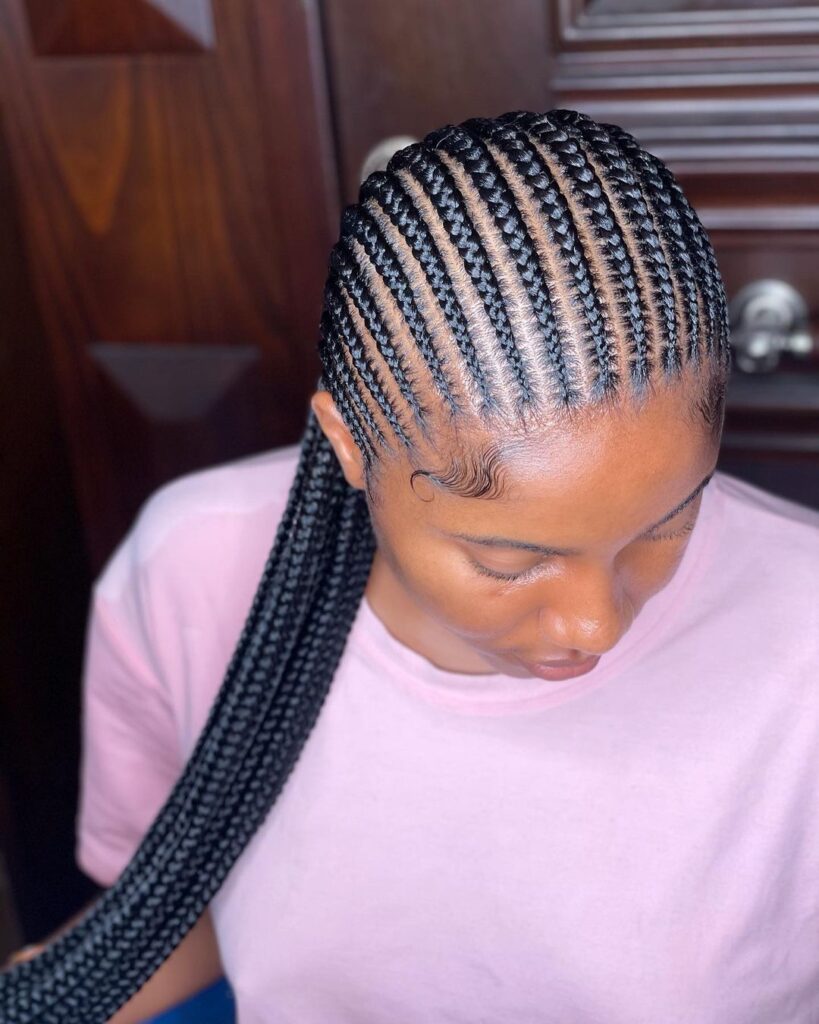 a lady with a feed in braids beautiful afro hairstyle