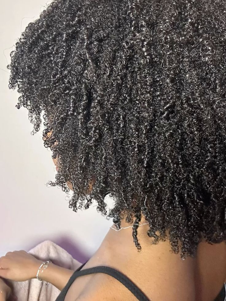 Natural curls styled with flaxseed gel for lasting definition.