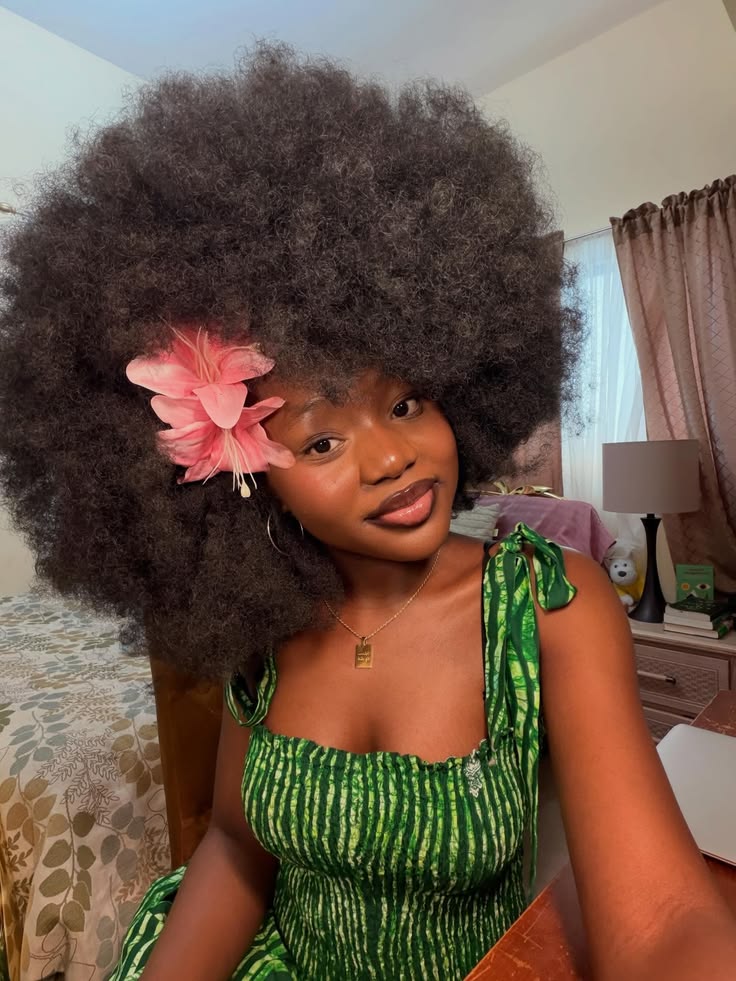 a girl with full afro hair and accessories