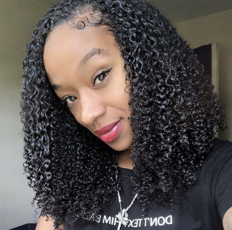Woman with a gel-defined curly Afro style.