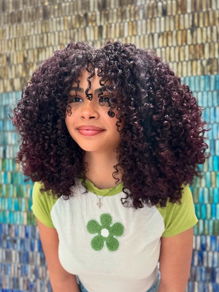 a girl wit curly afro hair