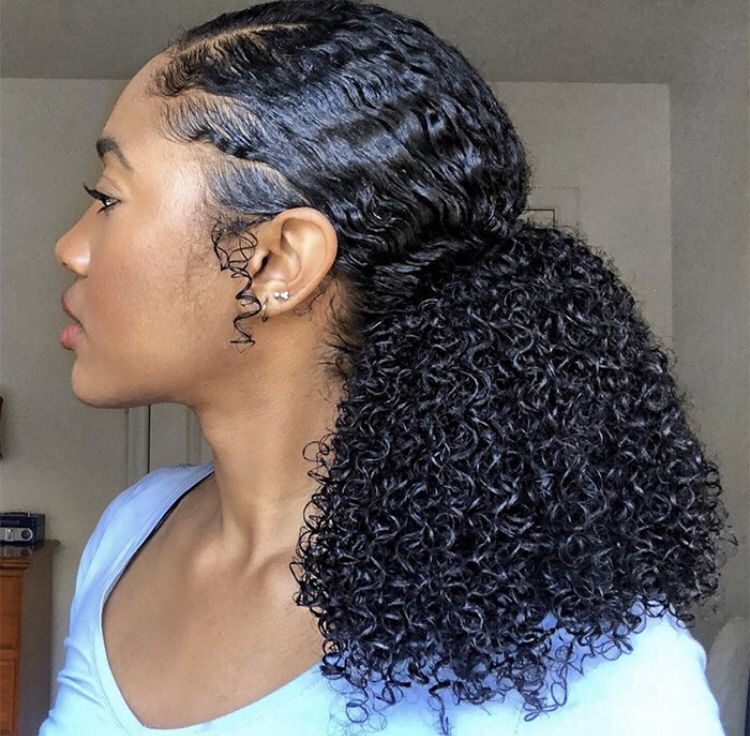 a girl with curly hair and well laid edges