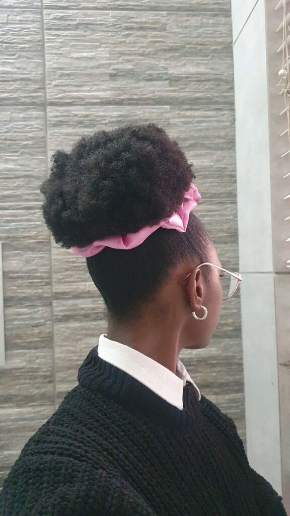 a girl that made a beautiful afro hairstyle called afro high puff