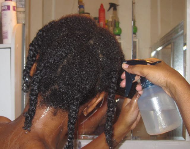 someone spraying haircare product to her high porosity hair