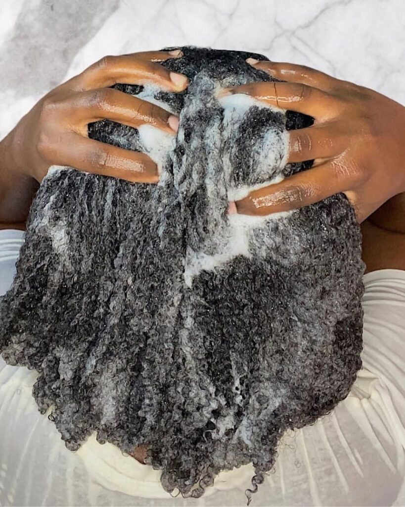 someone washing her hair