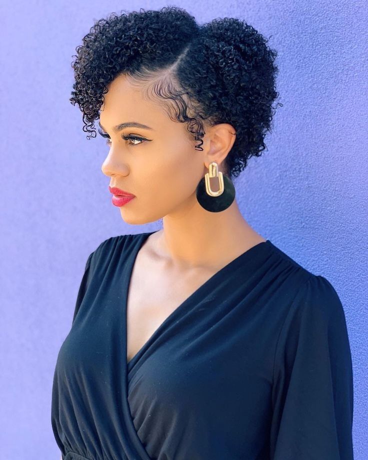 a fair lady with black half part afro hair