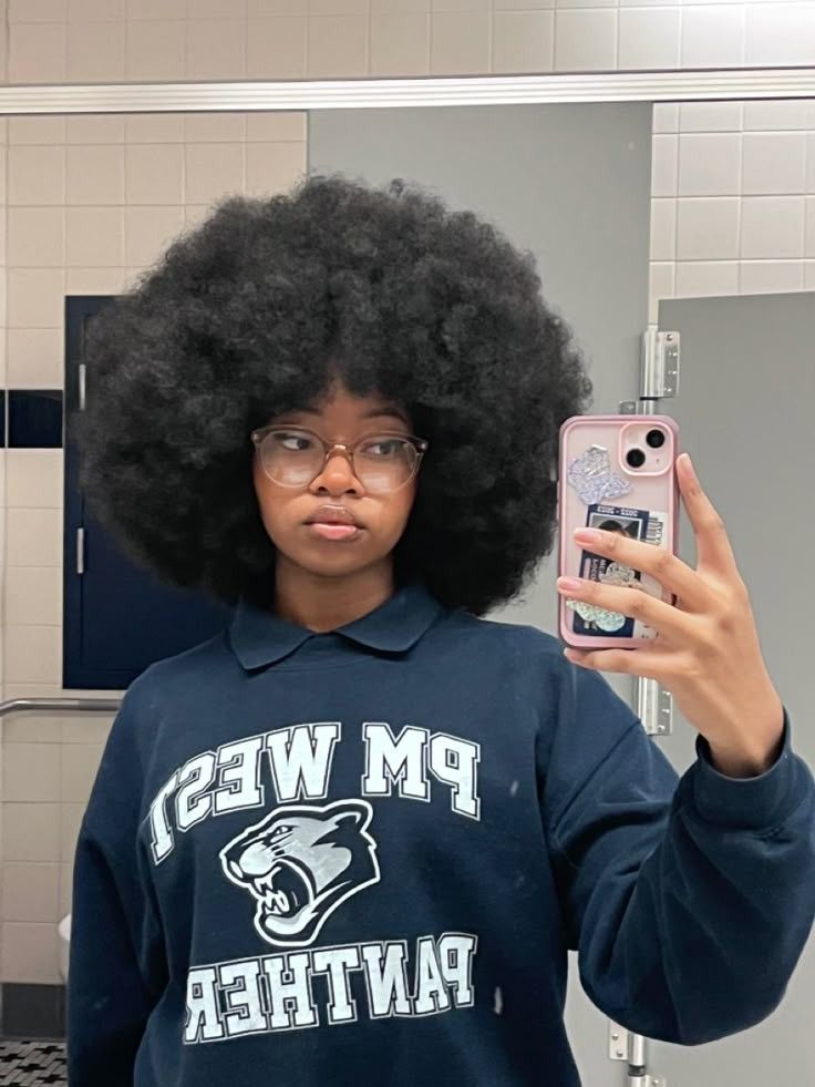 a girl with healthy afro hair