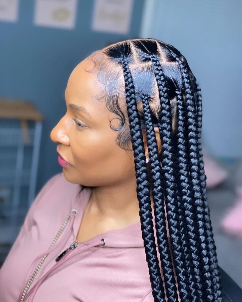 a girl with knotless braids
