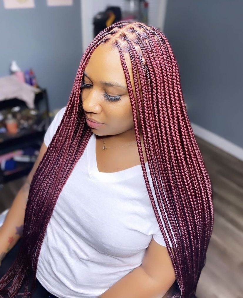 a girl that braided her hair with colored extension