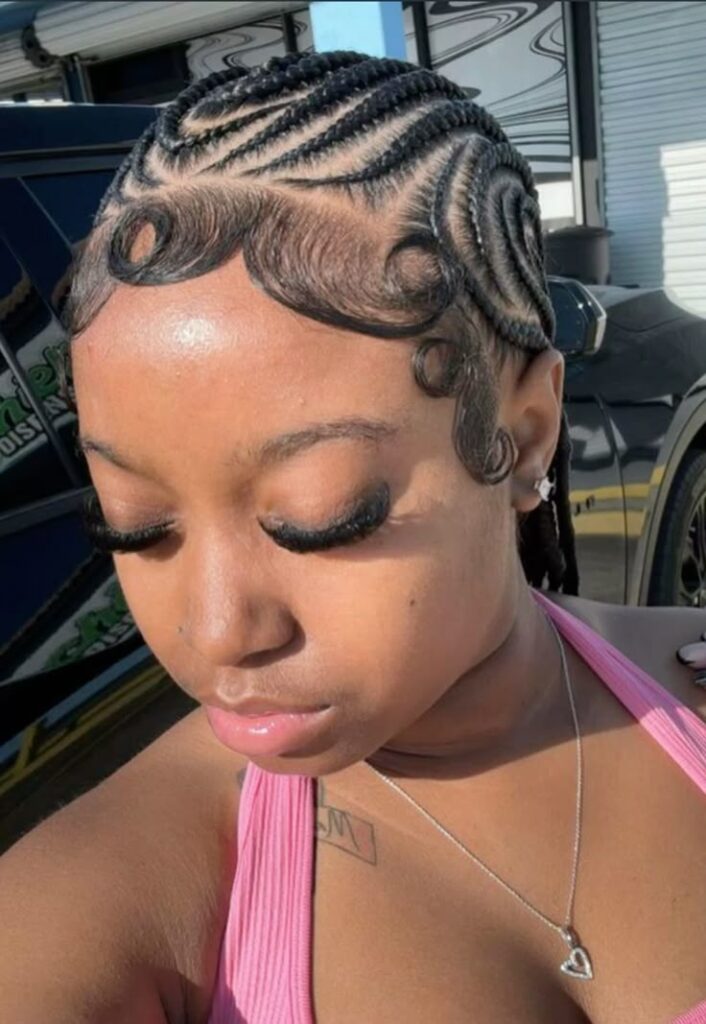 someone with feedi in braids with a well laid edges