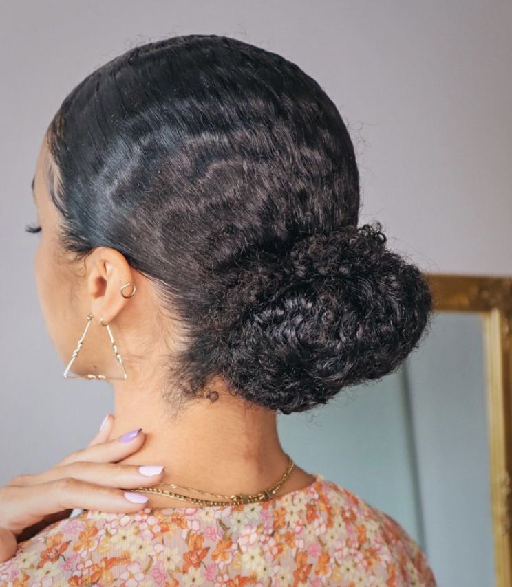 a girl on afro low bun as a simple beginners afro hairstyle