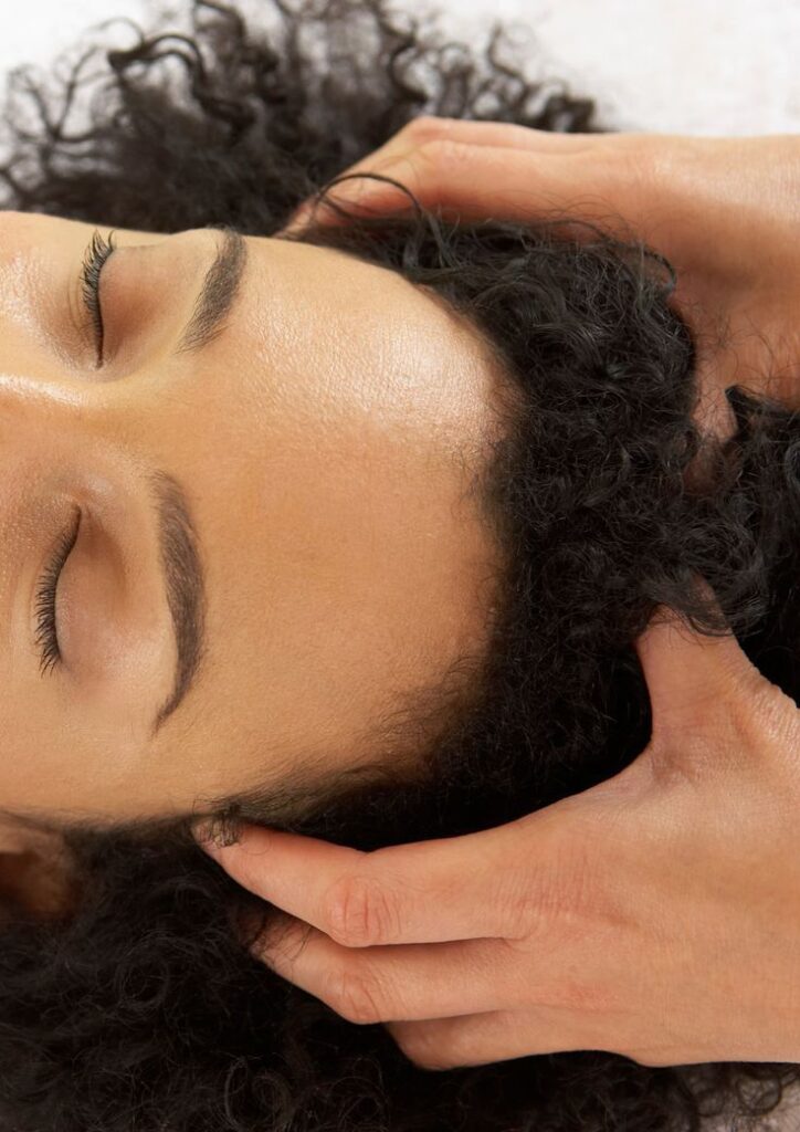 a lady getting her scalp message