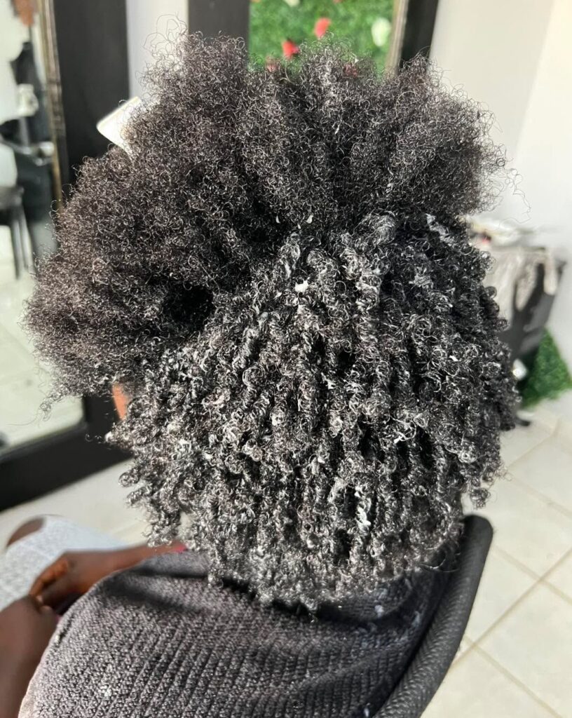 someone moisturizing her hair