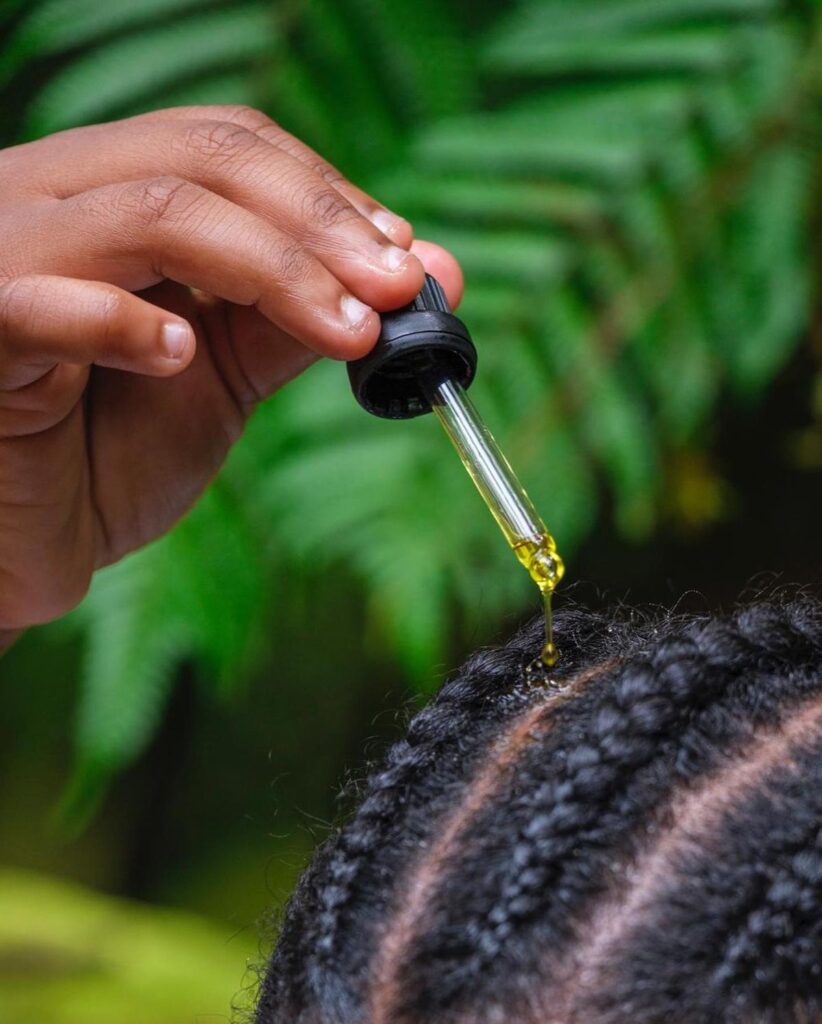 someone oiling her scalp