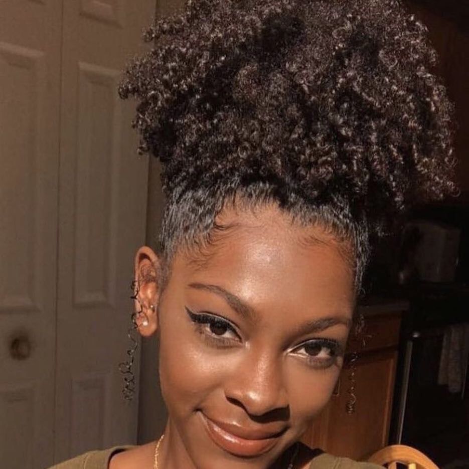 a girl with pineapple updo