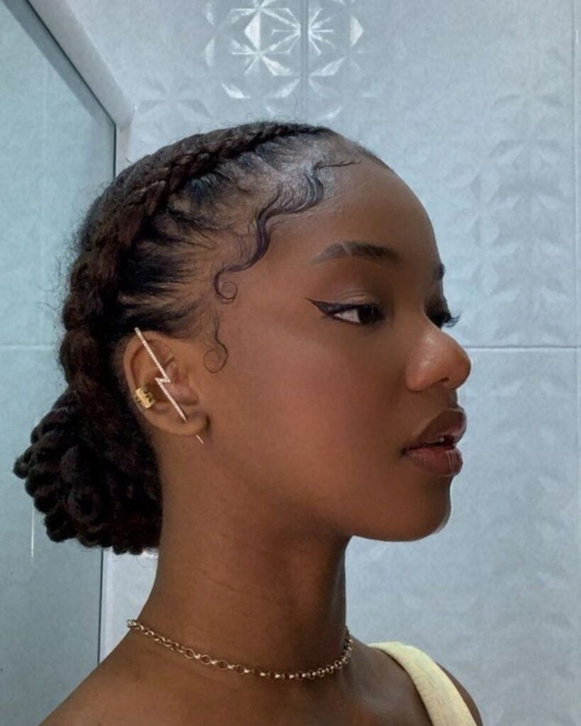 a girl with cornrows protective styling