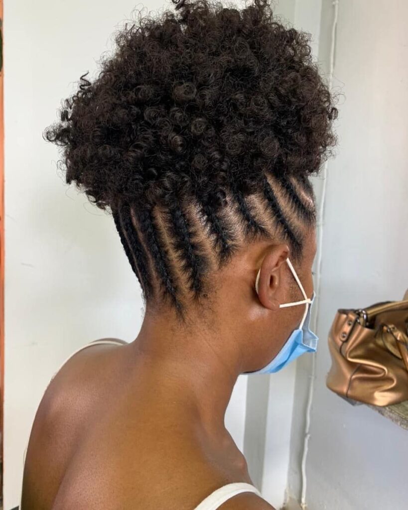 picture of a hair packed in the middle with cornrows weaved round it