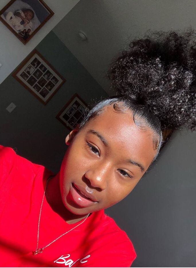 a girl that packed her hair up with edges well laid
