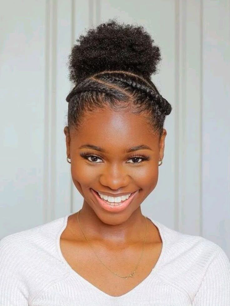 a girl packed up her hair with two braids by the sides